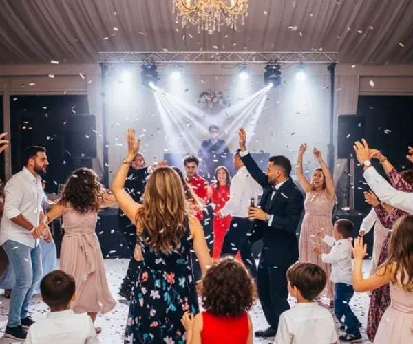 People dancing at a lively wedding reception.